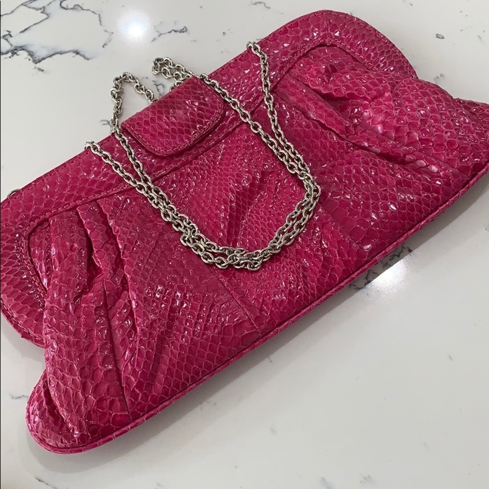 Snakeskin pink clutch